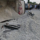 Image for article titled This Is What Happens When A Truck Full Of Crushed Stone Turns Over On A Car